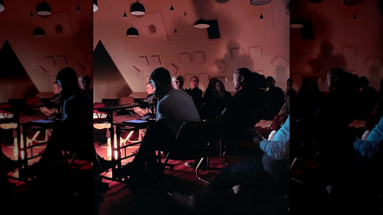 Audience seated at dim Audium theater