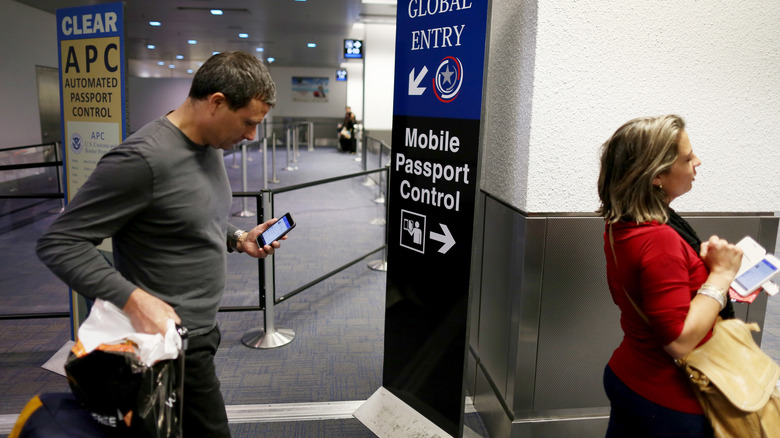 People queueing at mobile passport control