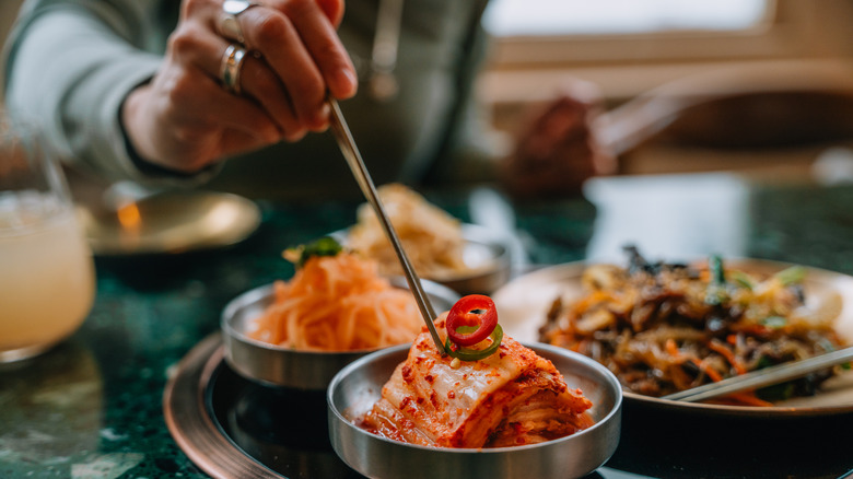 Person using chopsticks in Korean restaurant