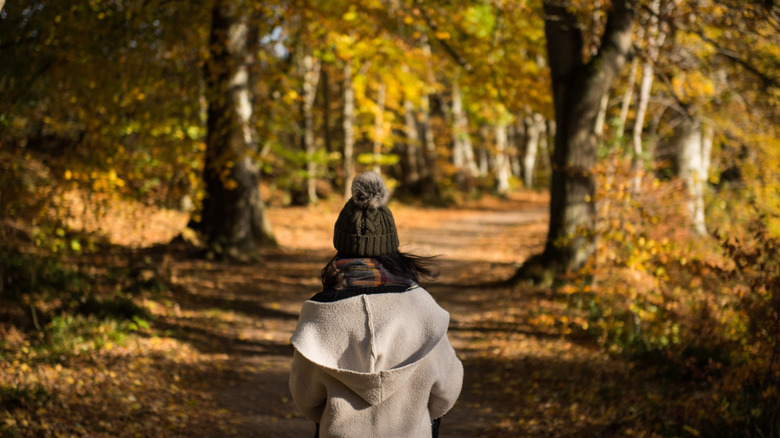 Woman walking on Lady Mary's Walk in Scotland