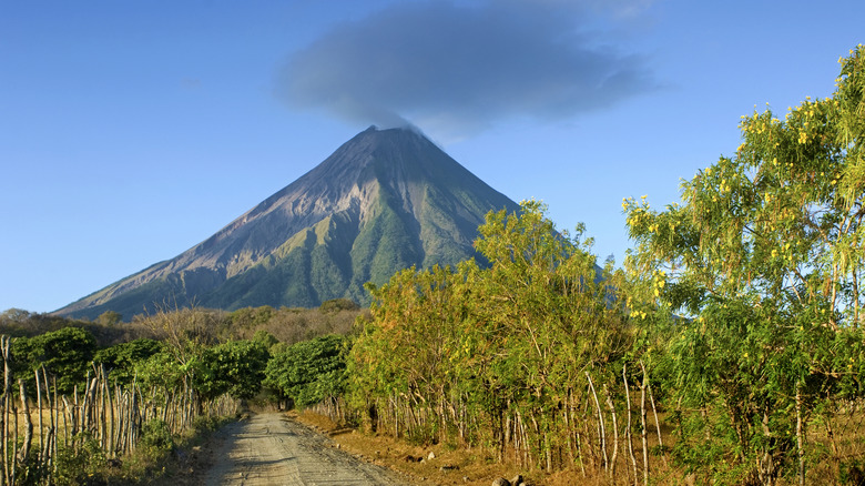 Fumes of an active volcano over road in Nicaragua