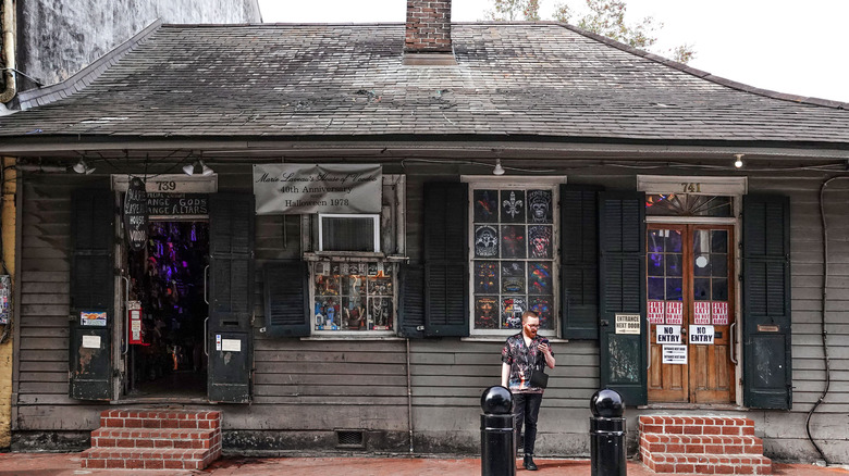 Man standing outside Marie Laveau's House of Voodoo