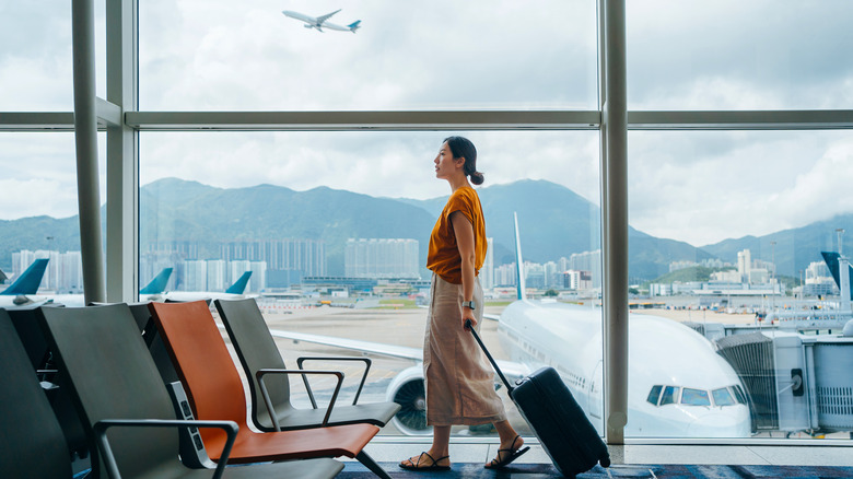 Woman with suitcase at airport