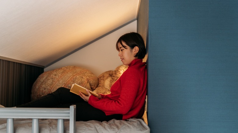 woman reading apartment loft