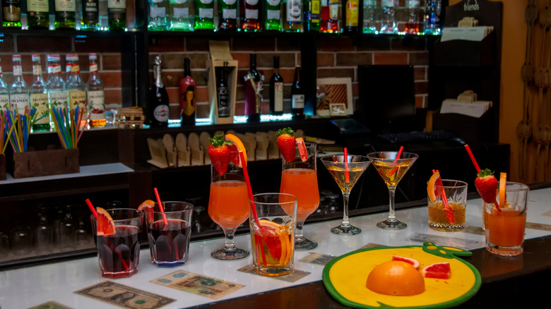 Colorful cocktails with strawberries at a bar