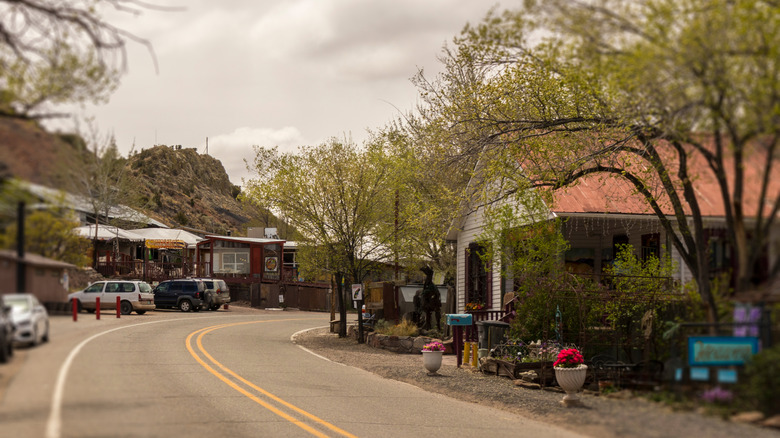 A roadway heading into Madrid, New Mexico