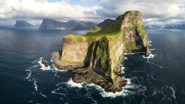 Kalosy island surrounded by ocean and clouds