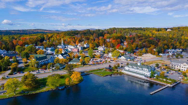 Waterfront, buildings, and colorful foliage in Meredith, New Hampshire