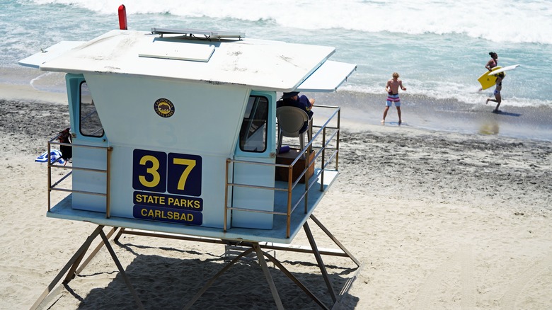 lifeguard station with kids in ocean