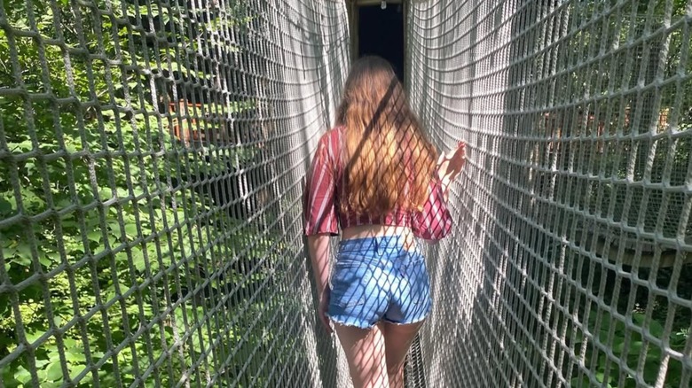 Girl walking through Treetop Village