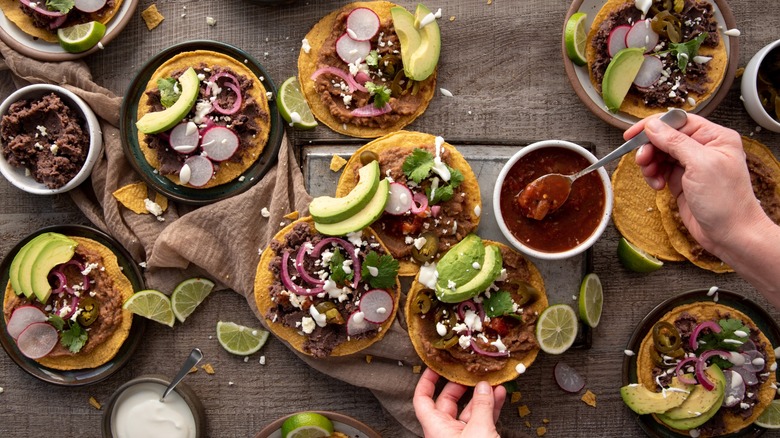 Overhead shot of tacos and salsa on table