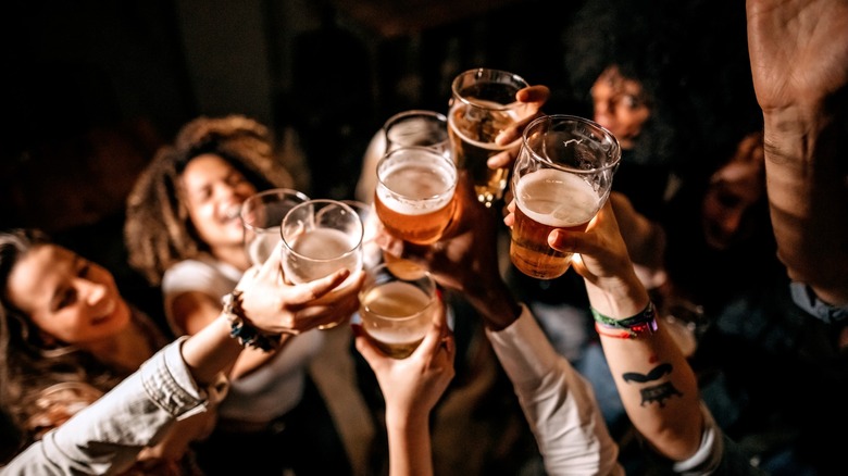 Friends toasting with beer