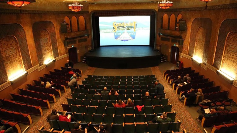 The Panida Theater with red ceiling lights and rows of seats during a film festival