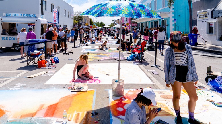 Artists working during the Lake Worth Beach Street Painting Festival