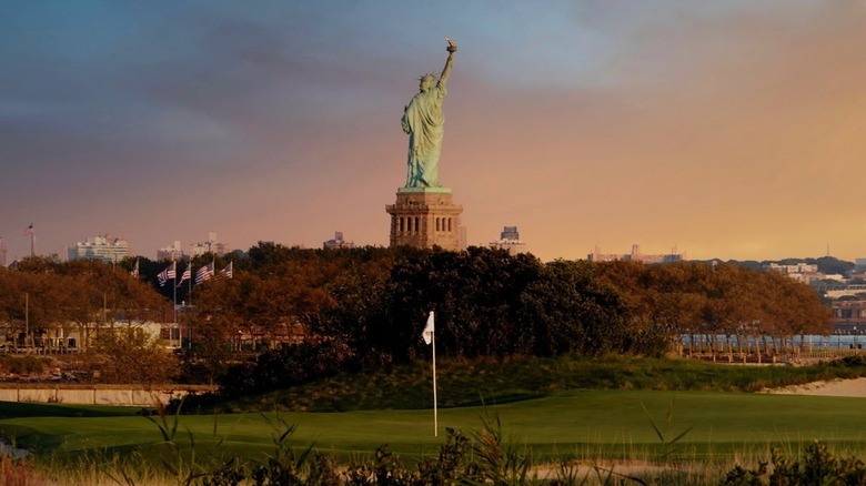 Bayonne Golf Course at sunset with Statue of Liberty in background