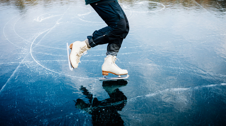 Ice skating frozen lake