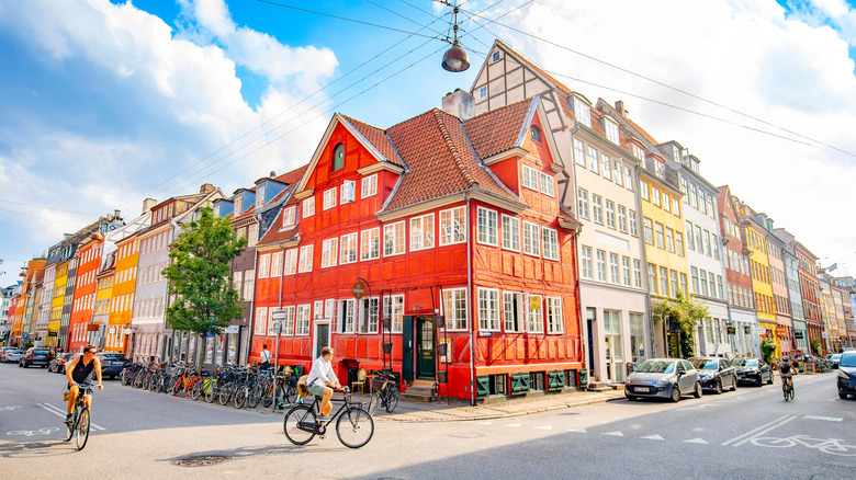 Cyclists on colorful Copenhagen street in Denmark