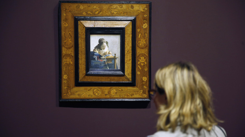 A single viewer admiring Vermeer's "The Lacemaker"