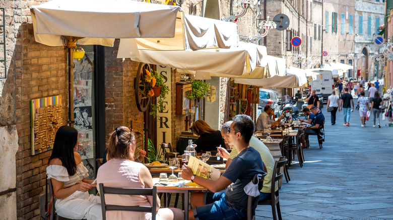 People sitting in outdoor Italian restaurants