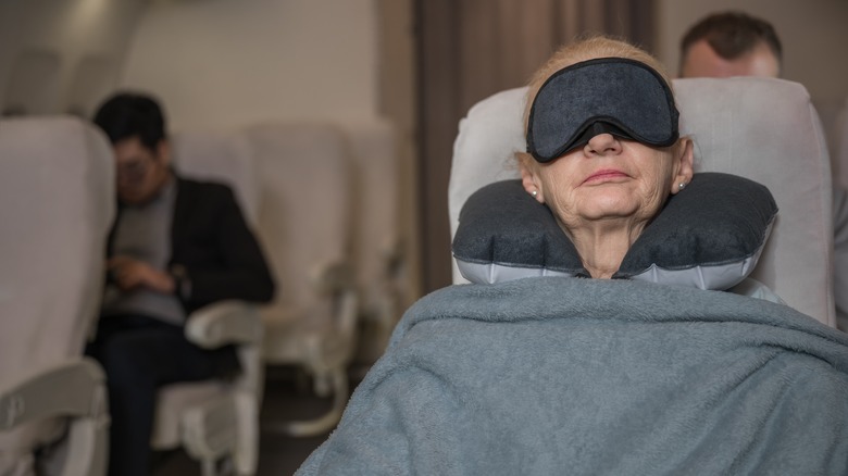 Woman sleeping on plane