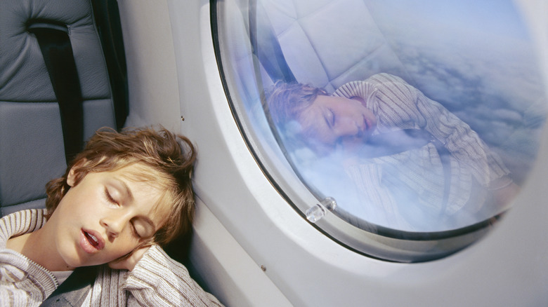 Person sleeping on plane