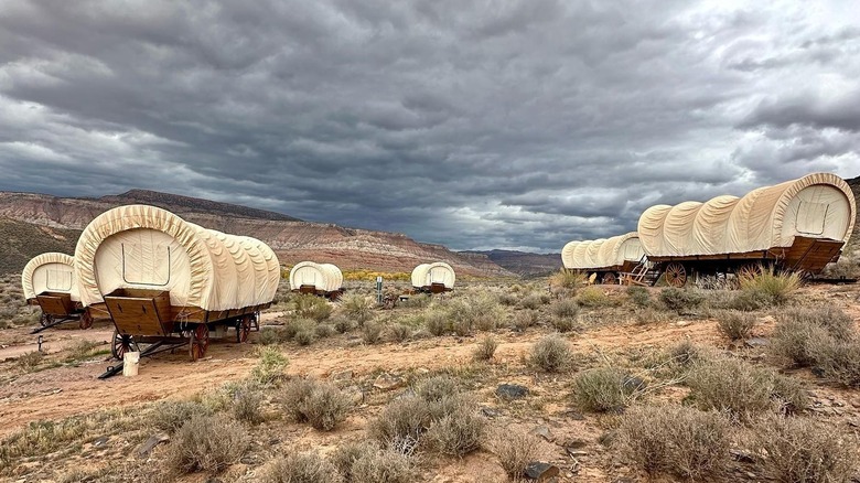 The covered wagons at Zion Wildflower Resort boarded up on a blustery desert day