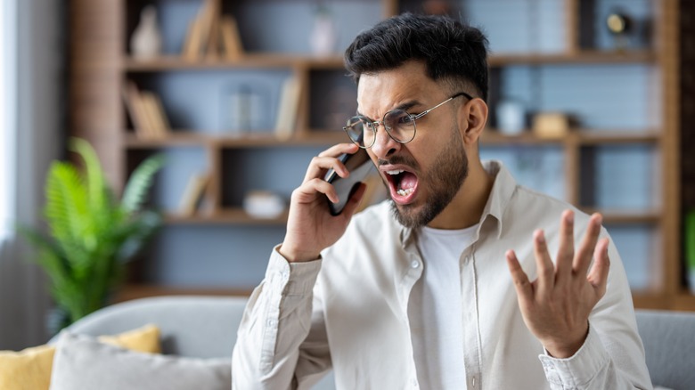 Man annoyed on phone call