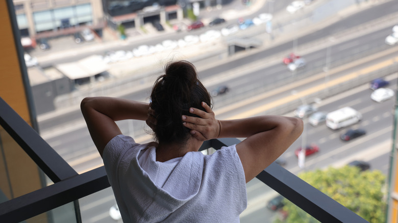 Woman stressed by street noise