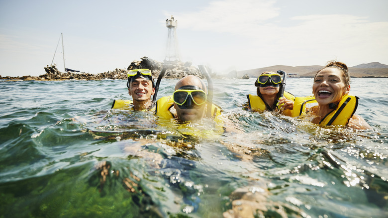 Family snorkeling together