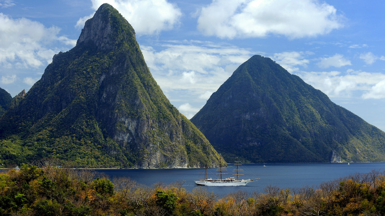 Volcanic mountains tower over sea