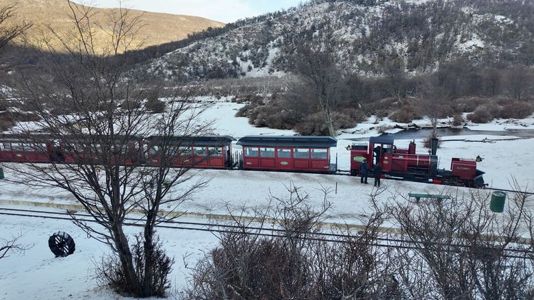 Train crossing through snowy mountains on Tierra del Fuego