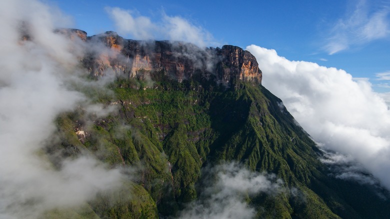 Tepui moutain between clouds in Colombia's Chiribiquete National Park