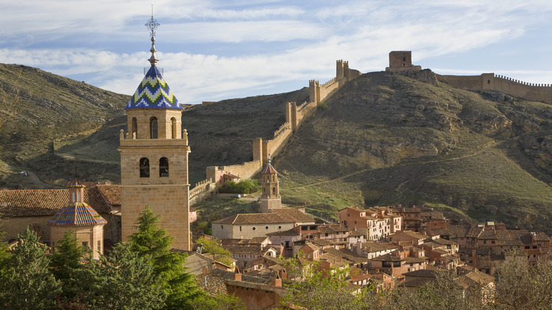 The colorful, tiled tower on the Catedral del Salvador in Albarracín, Spain