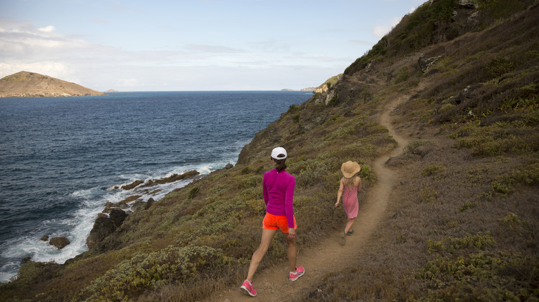 Mother and daughter on a scenic hiking trail in St. Barts