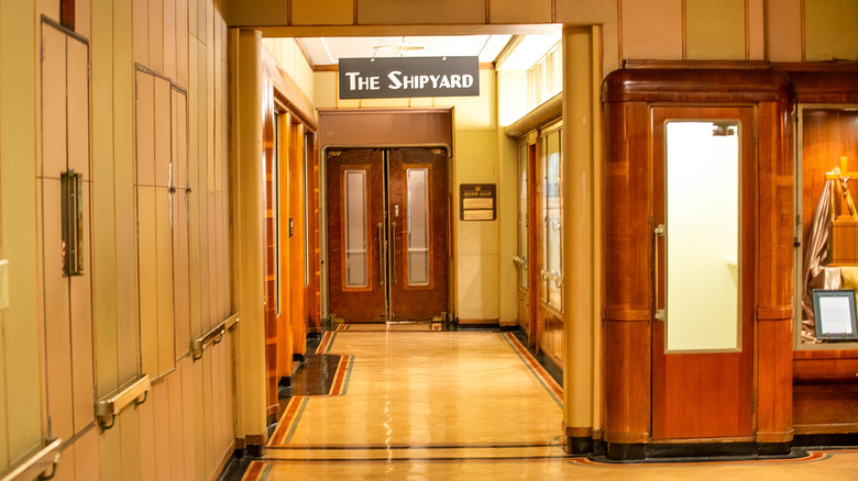 The brown inside of the Queen Mary with a hanging sign that says "The Shipyard"