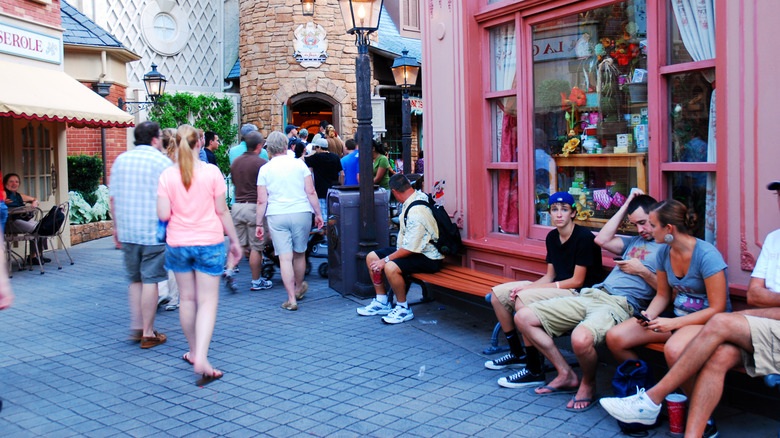 People sat on a bench in Disneyworld, Florida.