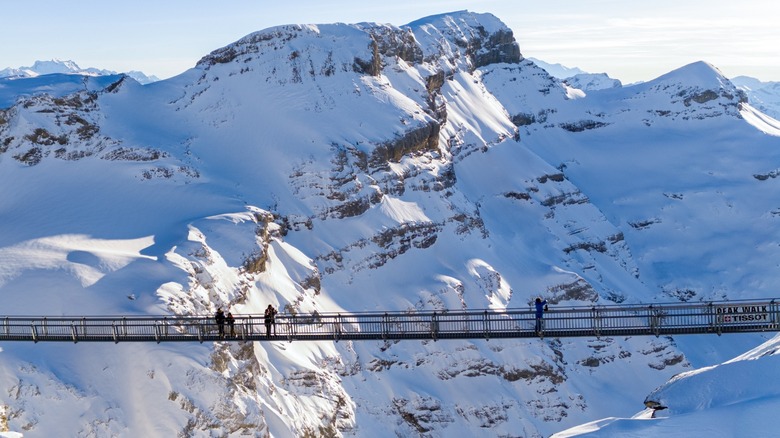 People on the Peak Walk by Tissot at the snowy Glacier 3000