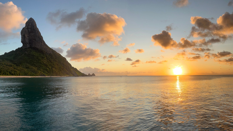 The calm waters of Brazil's Fernando de Noronha island at sunset