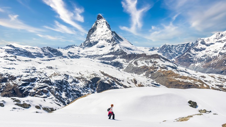 The Matterhorn in the Swiss Alps against a blue sky.