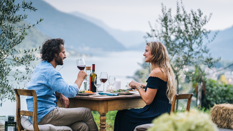 a couple toasts beside Lake Maggiore