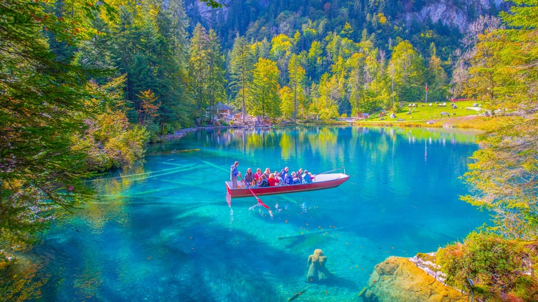 A group on a boat at Lake Blausee