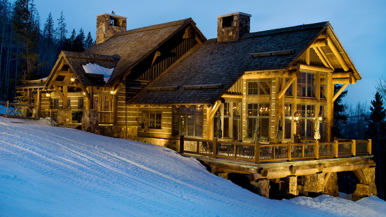 Exterior of Zach's Cabin illuminated at night in Beaver Creek, CO