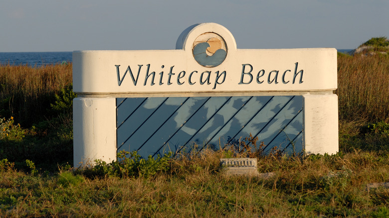 The Whitecap beach sign that greets you on arrival.