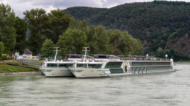 Two Tauck cruise vessels on a river in Austria.