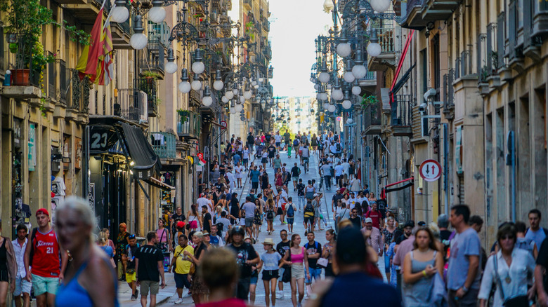 Crowded Barcelona street between buildings