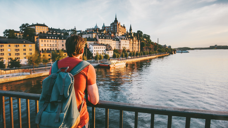 Backpacker looking out at the architecture in Stockholm