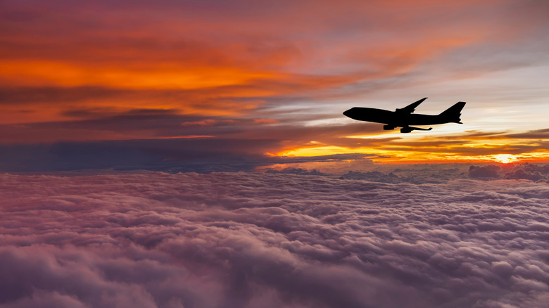 Commerical airplane above clouds