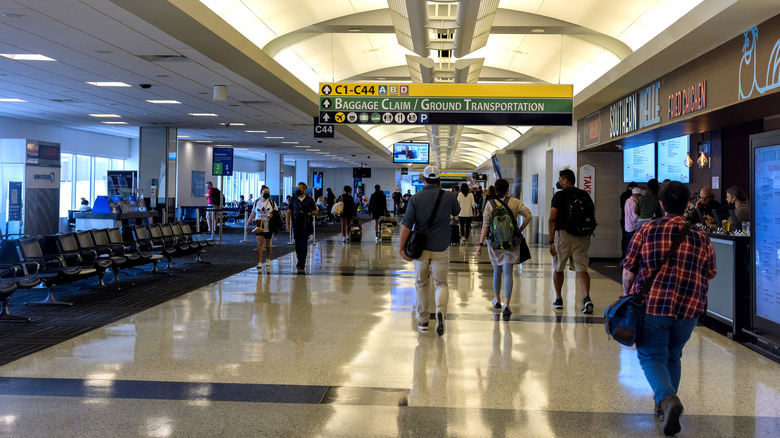 people walking through Houston airport