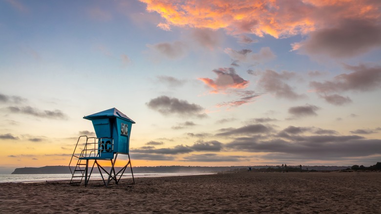 Sunset and a lifeguard tower in San Diego, California