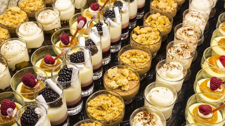 Rows of desserts buffet fruit biscuit and cream